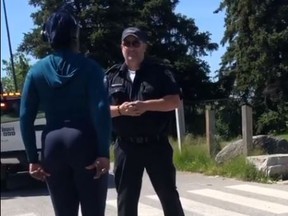 A still of an exchange between a woman and a Toronto bylaw officer at Centennial Park in Etobicoke on Tuesday, June 16 2020,