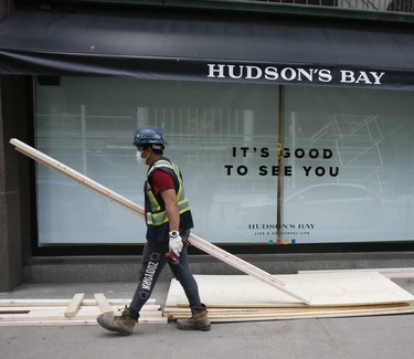 Workers board up Hudson's Bay Queen Street on Tuesday June 2, 2020. Veronica Henri/Toronto Sun/Postmedia Network