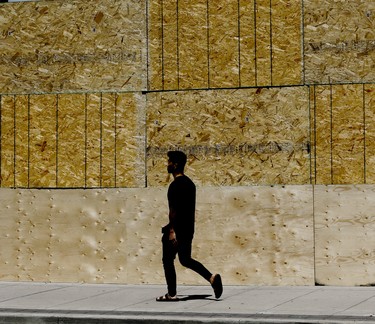 Workers board up Hudson's Bay Queen Street on Tuesday June 2, 2020. Veronica Henri/Toronto Sun/Postmedia Network