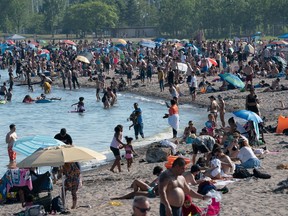 Thousands of visitors enjoy themselves on the beach in Toronto amid the gradual easing of Covid19 restrictions.