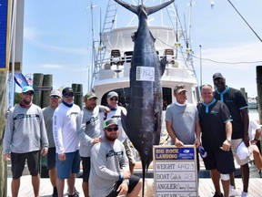 Michael Jordan, and a crew, caught a huge blue marlin at a tournament.