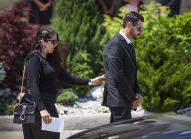 Michael Ciasullo, joined by his sister Connie Ciasullo - as they leave the funeral of his wife and children - Karolina, Klara, Lilianna and Mila Ciasullo  - at St. Eugene de Mazenod Catholic Church  in Brampton, Ont. on Thursday June 25, 2020.  The family members were killed in a tragic collision in Brampton on June 18. Ernest Doroszuk/Toronto Sun/Postmedia