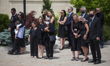 Michael Ciasullo, joined by his sister Connie Ciasullo (left) , watches the caskets of his wife and children - Karolina, Klara, Lilianna and Mila Ciasullo  - as they are carried into St. Eugene de Mazenod Catholic Church during their funeral in Brampton, Ont. on Thursday June 25, 2020.  The family members were killed in a tragic collision in Brampton on June 18. Ernest Doroszuk/Toronto Sun/Postmedia