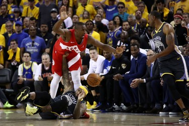 OAKLAND, CALIFORNIA - JUNE 13:  DeMarcus Cousins #0 of the Golden State Warriors and Serge Ibaka #9 of the Toronto Raptors battle for the ball in the second half during Game Six of the 2019 NBA Finals at ORACLE Arena on June 13, 2019 in Oakland, California.