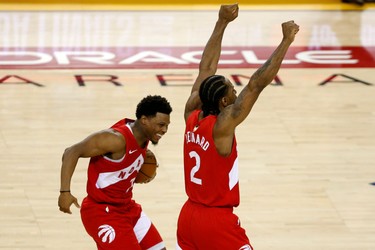 OAKLAND, CALIFORNIA - JUNE 13:  Kyle Lowry #7 and Kawhi Leonard #2 of the Toronto Raptors celebrates his teams win over the Golden State Warriors in Game Six to win the 2019 NBA Finals at ORACLE Arena on June 13, 2019 in Oakland, California.