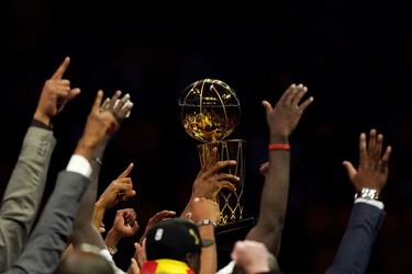 OAKLAND, CALIFORNIA - JUNE 13:  The Toronto Raptors celebrate with the Larry O'Brien Championship Trophy after defeating the Golden State Warriors to win Game Six of the 2019 NBA Finals at ORACLE Arena on June 13, 2019 in Oakland, California.
