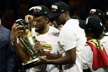 OAKLAND, CALIFORNIA - JUNE 13:  Kawhi Leonard #2 of the Toronto Raptors celebrates with the Larry O'Brien Championship Trophy after his team defeated the Golden State Warriors to win Game Six of the 2019 NBA Finals at ORACLE Arena on June 13, 2019 in Oakland, California.