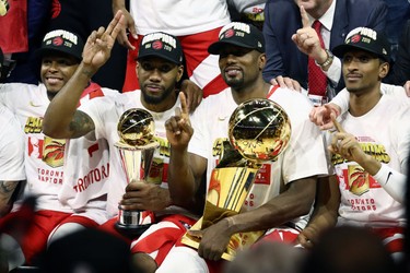 OAKLAND, CALIFORNIA - JUNE 13:  The Toronto Raptors celebrate with the Larry O'Brien Championship Trophy after their team defeated the Golden State Warriors to win Game Six of the 2019 NBA Finals at ORACLE Arena on June 13, 2019 in Oakland, California.