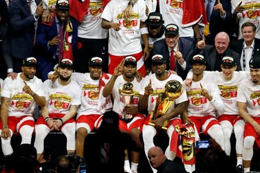 OAKLAND, CALIFORNIA - JUNE 13:  The Toronto Raptors pose for a photo after their team defeated the Golden State Warriors to win Game Six of the 2019 NBA Finals at ORACLE Arena on June 13, 2019 in Oakland, California.