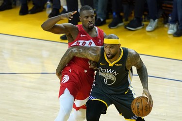 OAKLAND, CALIFORNIA - JUNE 13:  DeMarcus Cousins #0 of the Golden State Warriors is defended by Serge Ibaka #9 of the Toronto Raptors in the second half during Game Six of the 2019 NBA Finals at ORACLE Arena on June 13, 2019 in Oakland, California.