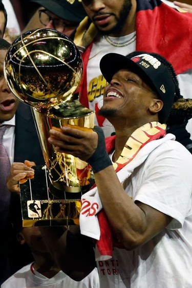 OAKLAND, CALIFORNIA - JUNE 13:  Kyle Lowry #7of the Toronto Raptors celebrates with the Larry O'Brien Championship Trophy after his team defeated the Golden State Warriors to win Game Six of the 2019 NBA Finals at ORACLE Arena on June 13, 2019 in Oakland, California.