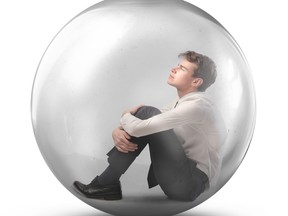 Young businessman sitting in a bubble