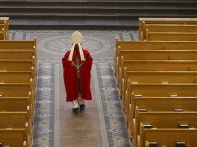 Roman Catholic Cardinal Thomas Colllins presides over Good Friday mass at St, Michael's Cathedral Basilica on Bond St. on Friday, April 10, 2020.