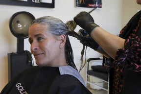 Kerri Lynn Davidson gets her hair coloured at Barrie’s Elite Hair Salon, which she co-owns. JACK BOLAND/TORONTO SUN