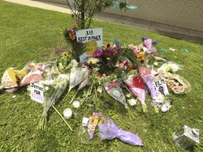Memorial outside 100 High Pk. Ave. to honor the life of 29-year-old Regis Korchinski-Paquet, who died after falling from a 24th-floor apartment balcony on July 25, 2020.