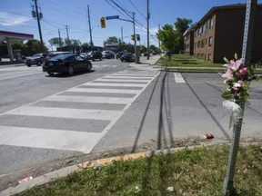 A bouquet of flowers at the scene of an overnight hit and run at the corner Calvington Dr. at Keele St., north of Wilson Ave. in Toronto, Ont. on Sunday June 7, 2020.