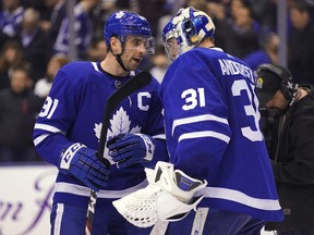 Toronto Maple Leafs forward John Tavares (91) congratulates goaltender Frederik Andersen (31) after defeating the Tampa Bay Lightning at Scotiabank Arena.