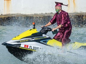 A graduate of Somerset Island Prep, a charter school in Key West, takes to the water to receive a diploma.