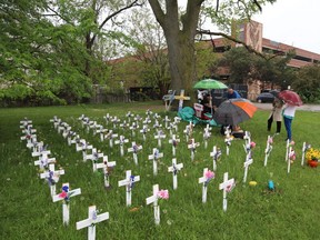 Crosses erected outside Camilla Care Community long-term care home representing the residents who have died from COVID-19, during a hunger strike by Innis Ingram May 28, 2020.