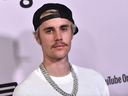 In this file photo, Canadian singer Justin Bieber arrives at the Regency Bruin Theatre in Los Angeles on Jan. 27, 2020.