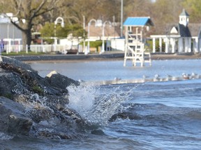 Waves splashing against the rocks by Cobourg beach.