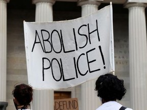 Demonstrators take part in a protest against racial inequality in the aftermath of the death in Minneapolis police custody of George Floyd outside City Hall in Baltimore, Maryland, U.S., June 12, 2020.