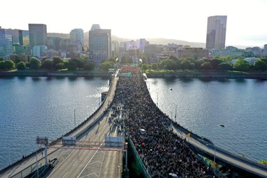 Protesters cross Morrison Bridge while rallying against the death in Minneapolis police custody of George Floyd, in Portland, Oregon, U.S. June 3, 2020. Picture taken with a drone.