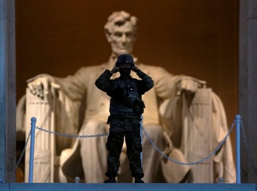 At sunrise, a soldier keeps watch at the Lincoln Memorial after a night of protests over the death in Minneapolis police custody of George Floyd in Washington, U.S., June 4, 2020.