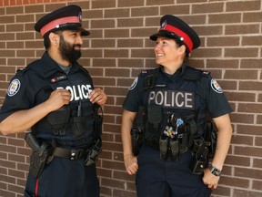 Toronto Police officers Const. Ramandeep Singh (left) and Const. Deanna Jovanovich of 23 Division are being hailed as heroes after they rescued a six-year-old boy who was being dangled out of a third-storey townhouse window by his distressed father Sunday, June 14, 2020 at 1 a.m.
