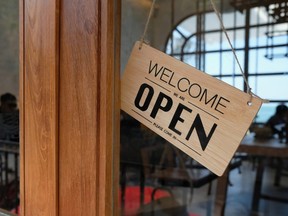 An open sign in a business window.