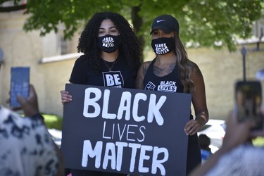 Organizers Hannah Hodder and Jessica Hoffstetter pose for a photo at Sunday’s Black Lives Matter protest at Victoria Park in Woodstock.