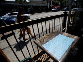 The owners of Stratengers Restaurant and Bar Dharam Vijh and his brother Anil prepare their patio section for reopening on Thursday, June 4, 2020 in Leslieville.