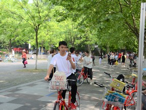 Public bikes are widely used in Hangzhou, China not just for commuting but for exploring public amenities.