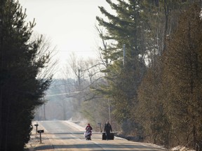 A family of four from Pakistan walk down Roxham Road in Champlain, N.Y. towards the U.S.-Canada border on Feb. 28, 2017.