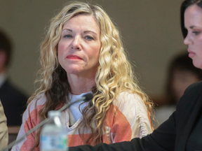 This March 6, 2020, file photo shows Lori Vallow, left, glancing at the camera next to her defense attorney, Edwina Elcox, during a hearing in Rexburg, Idaho.