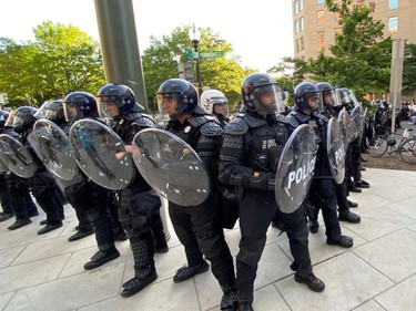 U.S. Secret Service uniformed division officers face off with protestors as they block a street near the White House in Washington June 1, 2020.