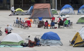 A group of people are stationed with tents set up in Nathan Phillips Square on Thursday, June 25, 2020. Some of these people have been less than welcoming to visitors in the area. CRAIG ROBERTSON/TORONTO SUN