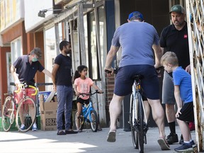 Brisk business at bicycle stores throughout Toronto, as more people take up cycling that may have used mass transit. A line-up at Cycle solutions on Kingston Rd., in the Beach neighbourhood of Toronto, on Tuesday May 26, 2020.