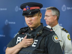 Toronto Police Service  Const. Ben Seto with a body-worn camera during the announcement of the  pilot project at police headquarters in Toronto, Ont.  on Friday May 15, 2015.