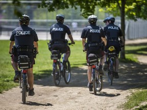 Police patrol Trinity Bellwoods Park in Toronto on Sunday May 24, 2020.