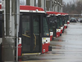 Buses wait to go into service at the Comstock TTC yards on March 23, 2020.