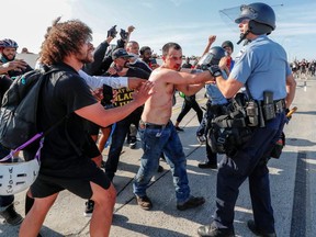 Police apprehend the driver of a tanker truck who drove into hundreds of protesters in Minneapolis, Minnesota, May 31, 2020.
