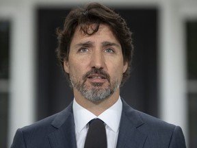 Prime Minister Justin Trudeau looks at the camera as he responds to a question about China during a news conference outside Rideau Cottage in Ottawa, Thursday, June 25, 2020.