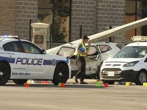 Special Investigations Unit officers investigate a multiple car collision at the intersection at Torbram Rd. and Countryside Dr. In Brampton on June 18, 2020. A woman and her three children were killed.