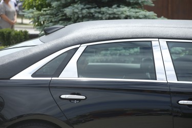 Michael Ciasullo can be seen in the rear window of a limousine as he attends the funeral at the front of St. Eugene De Mazenod Catholic Church in Brampton for his wife Karolina and their three daughters Klara, Mila and Lilianna who were killed last Thursday arrive at the church  . Jack Boland/Toronto Sun/Postmedia Network