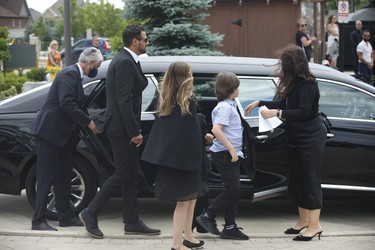 Michael Ciasullo  (L) exits the limousine with family as he attends the funeral at St. Eugene De Mazenod Catholic Church in Brampton for his wife Karolina and their three daughters Klara, Mila and Lilianna who were killed last Thursday arrive at the church  . Jack Boland/Toronto Sun/Postmedia Network