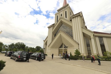 The hearses arrive at the front of St. Eugene De Mazenod Catholic Church in Brampton arrive for the funerals for Karolina Ciasullo and her three daughters Klara, Mila and Lilianna who were killed last Thursday arrive at the church  . Jack Boland/Toronto Sun/Postmedia Network