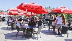 Patrons enjoy an outdoor patio at Turtle Jacks' as Port Carling welcomes tourist back to the area after the Muskoka area enters stage two of lifting the COVID-19 lockdown on Thursday, June 18, 2020.