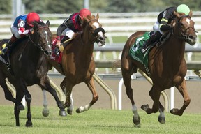 Jockey Emma-Jayne Wilson guides four-year-old chestnut filly Elizabeth Way to victory in Saturday’s Grade II $175,000 Nassau Stakes at Woodbine Racetrack.