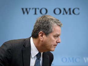 In this file photo taken on December 10, 2019 World Trade Organization Director General Roberto Azevedo arrives to a WTO general council meeting in Geneva.